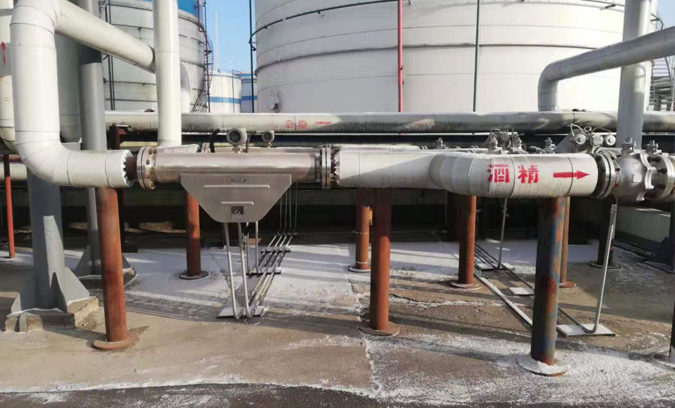 Coriolis flow meter for alcohol mass flow measurement